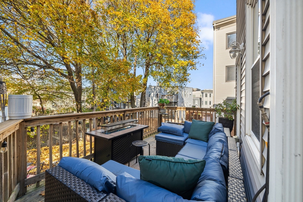 37 M Street Boston, MA 02127 - Photo 3 of 42 a view of a balcony with couches and wooden floor