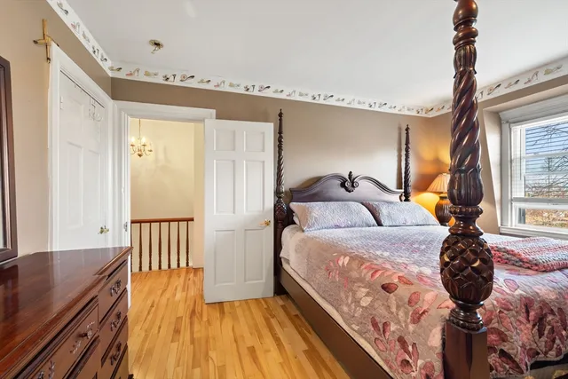 a bed room with a bed and a window