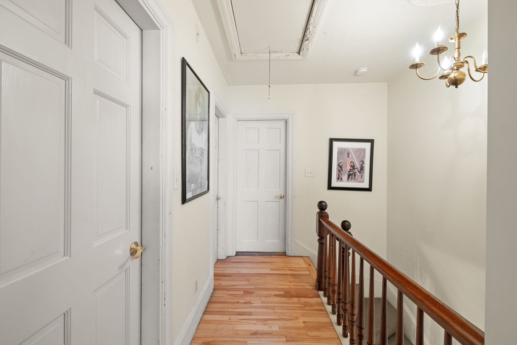 37 M Street Boston, MA 02127 - Photo 35 of 42 a view of a hallway with wooden floor and staircase