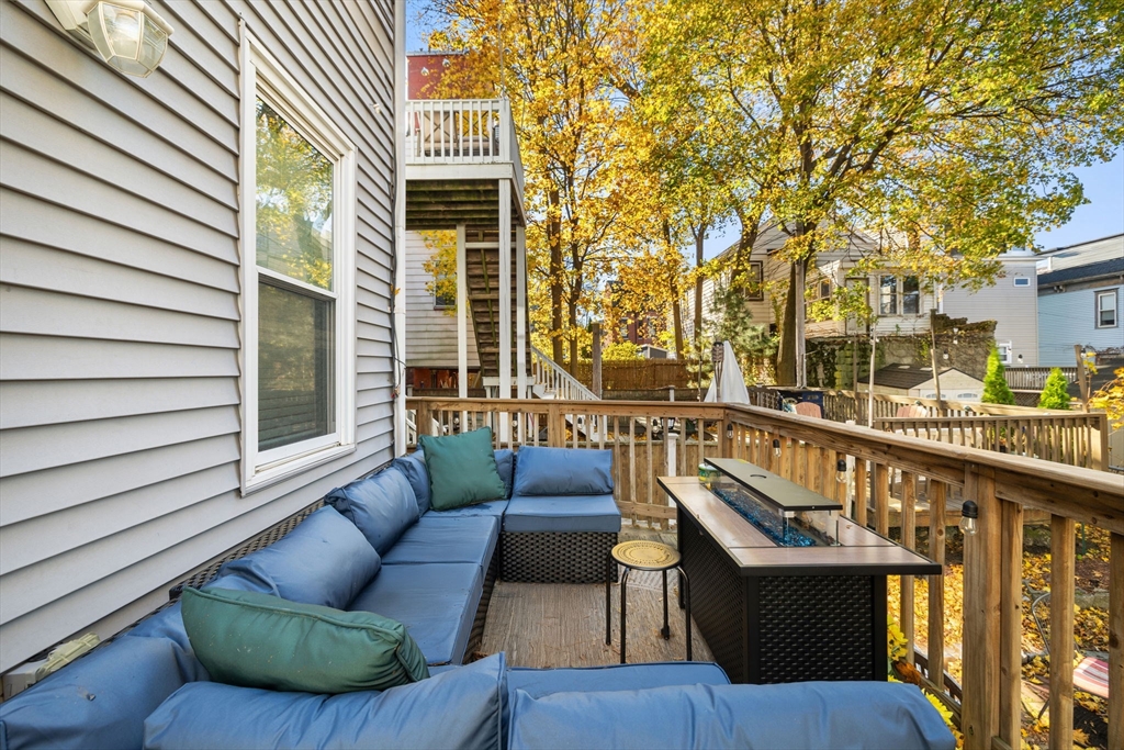 37 M Street Boston, MA 02127 - Photo 4 of 42 a balcony with couches and a potted plant on a table