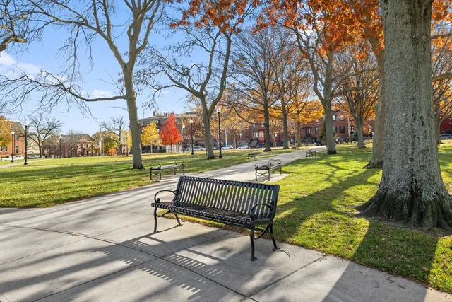 a swimming pool with outdoor seating and yard