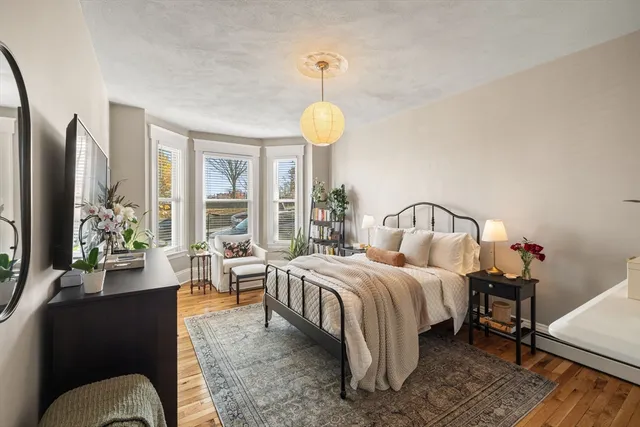 a bed room with a bed and a chandelier