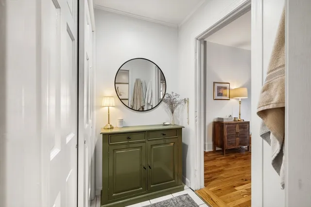 a view of a livingroom with furniture and a mirror