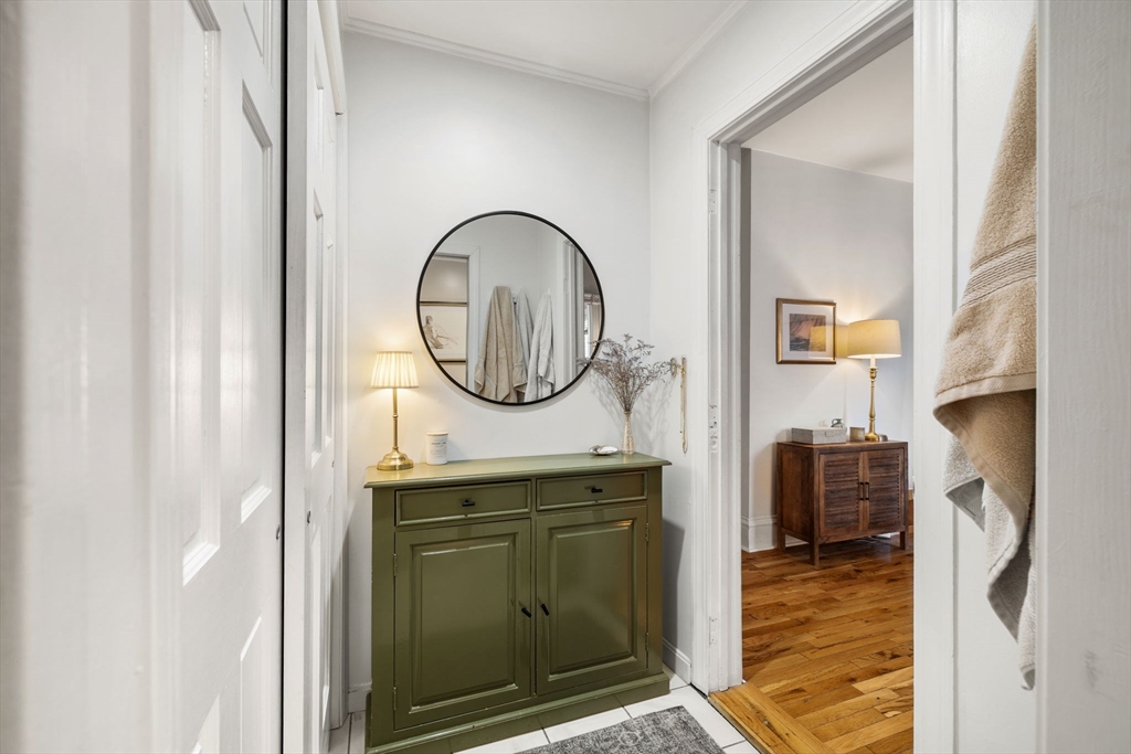 37 M Street Boston, MA 02127 - Photo 9 of 42 a view of a livingroom with furniture and a mirror