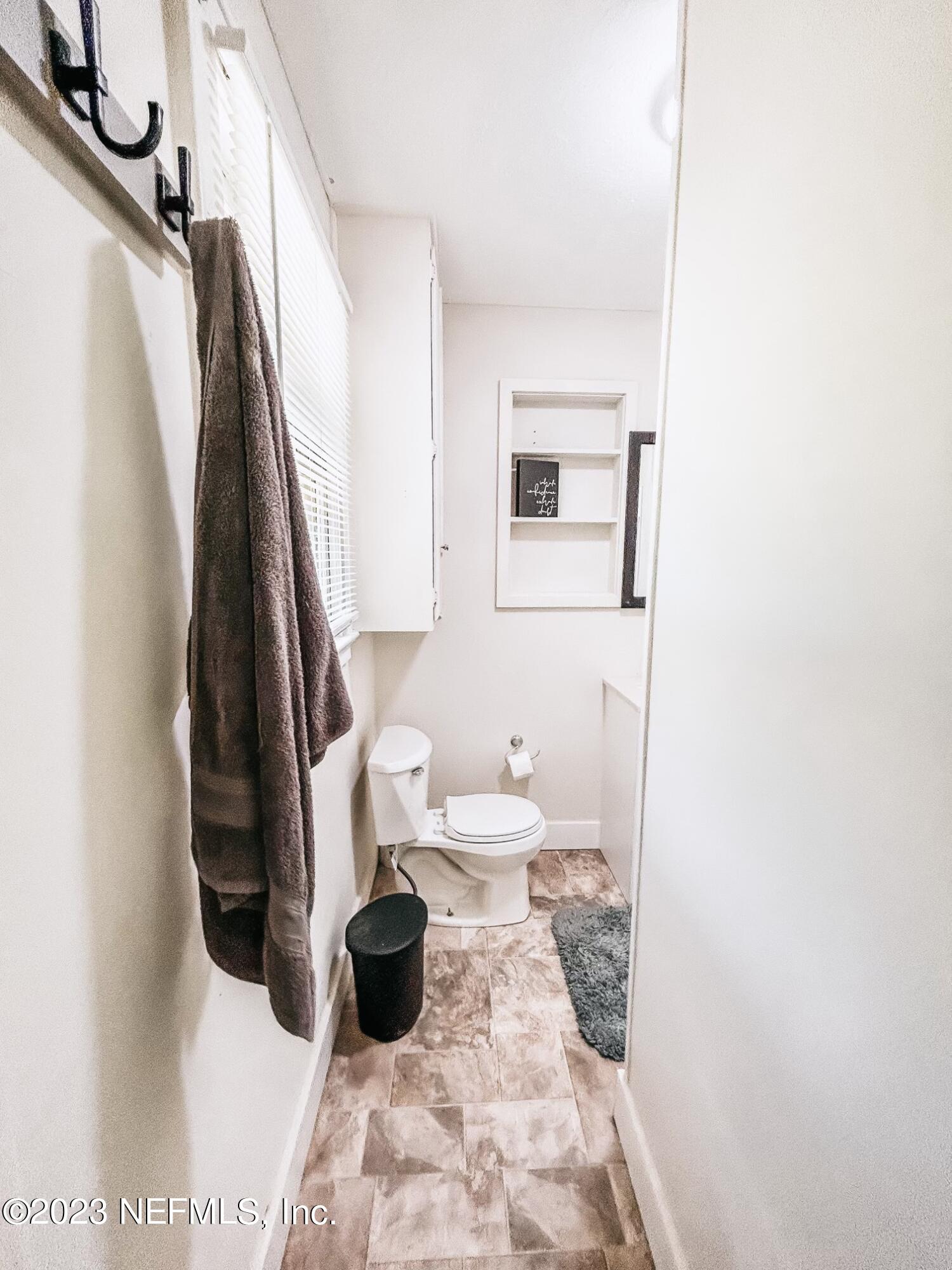 224 Benham Street Palatka, FL 32177 - Photo 12 of 15 a bathroom with a sink and a toilet
