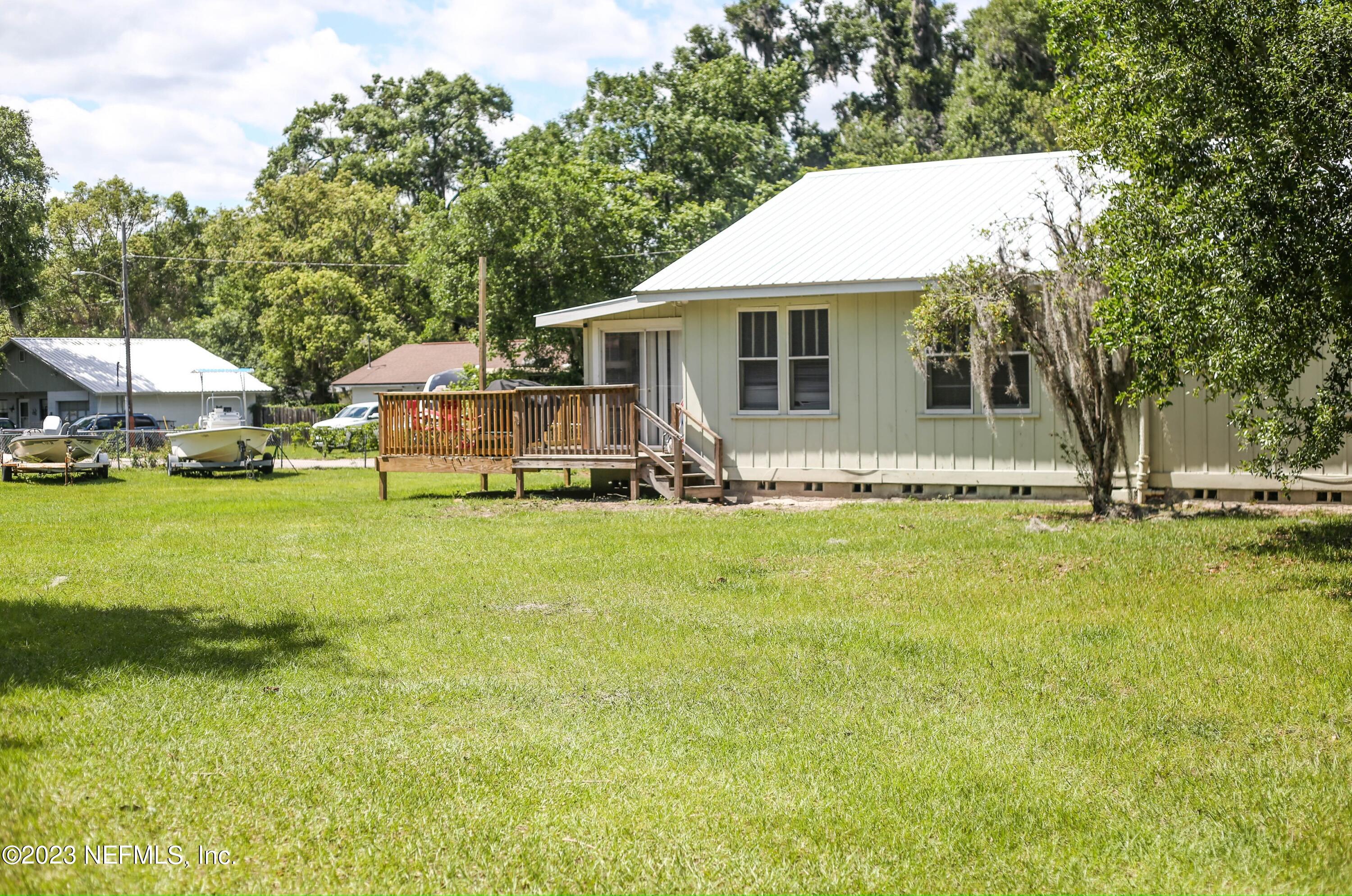 224 Benham Street Palatka, FL 32177 - Photo 15 of 15 a front view of a house with garden
