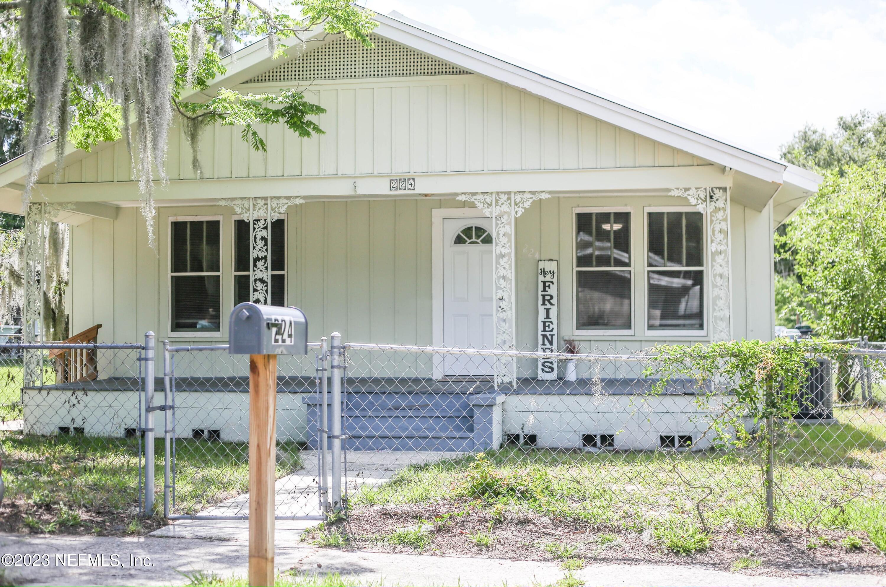 224 Benham Street Palatka, FL 32177 - Photo 2 of 15 a front view of a house with garden