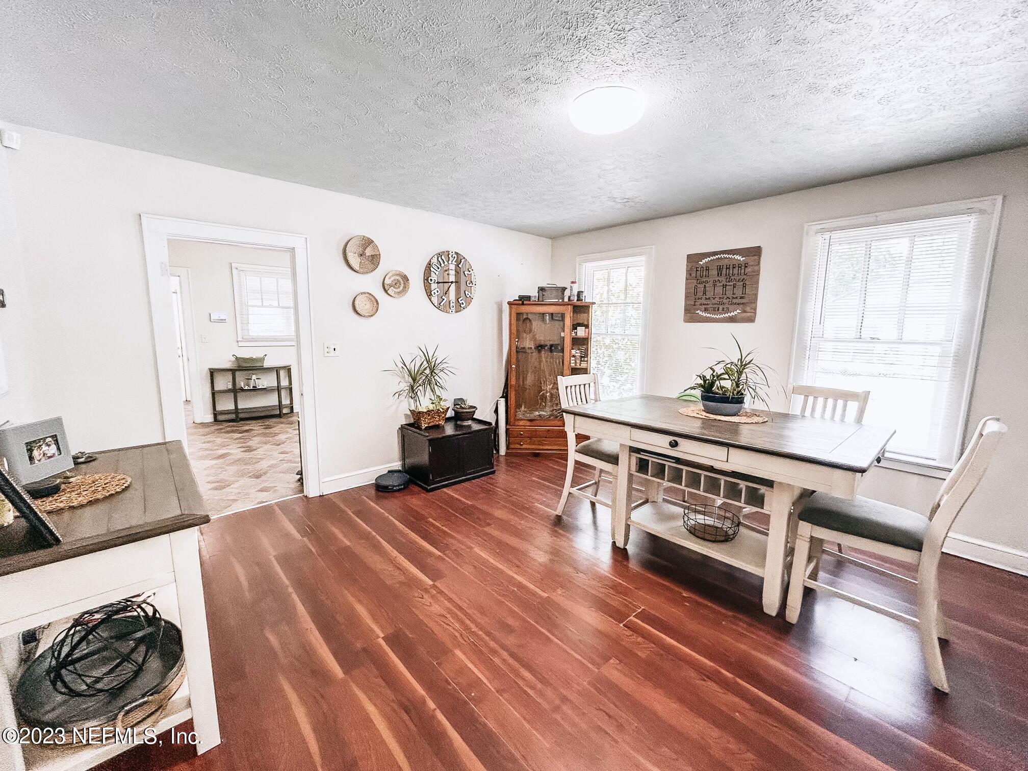224 Benham Street Palatka, FL 32177 - Photo 4 of 15 a bedroom with furniture and a wooden floor