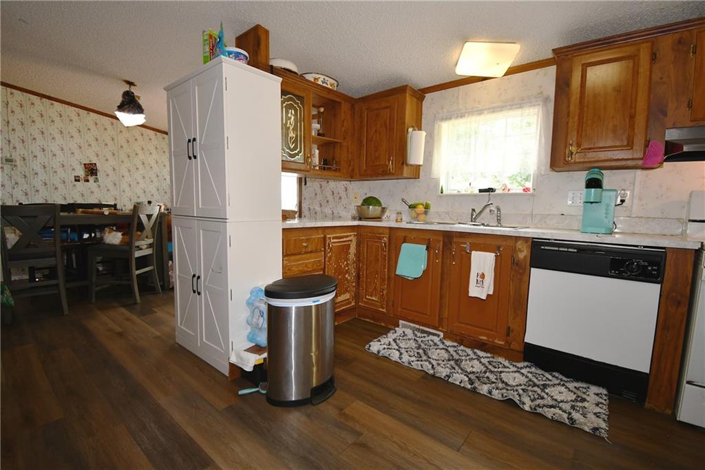 45 Perkins Lane Burgettstown, PA 15021 - Photo 11 of 27 a kitchen with a sink cabinets and wooden floor