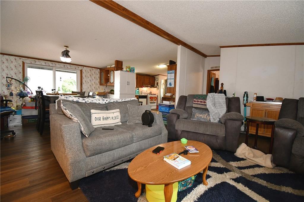45 Perkins Lane Burgettstown, PA 15021 - Photo 15 of 27 a living room with fireplace furniture and a wooden floor