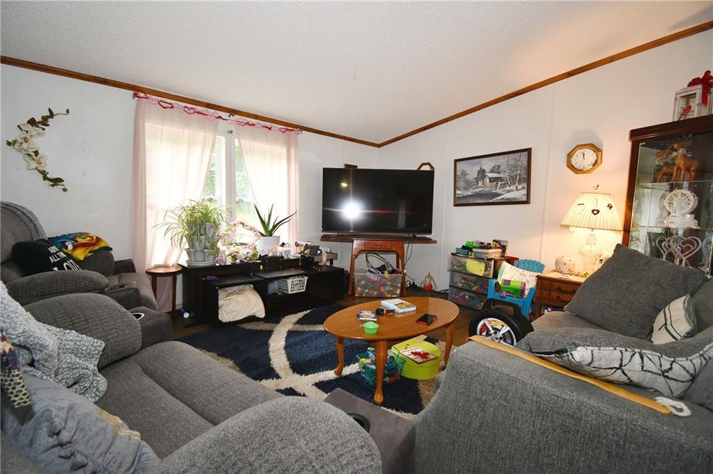 45 Perkins Lane Burgettstown, PA 15021 - Photo 16 of 27 a living room with furniture and a flat screen tv