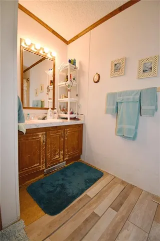 a view of a living room with a sink and cabinets
