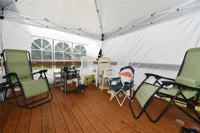 a living room filled with furniture and wooden floor