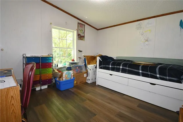 a living room with furniture and flat screen tv