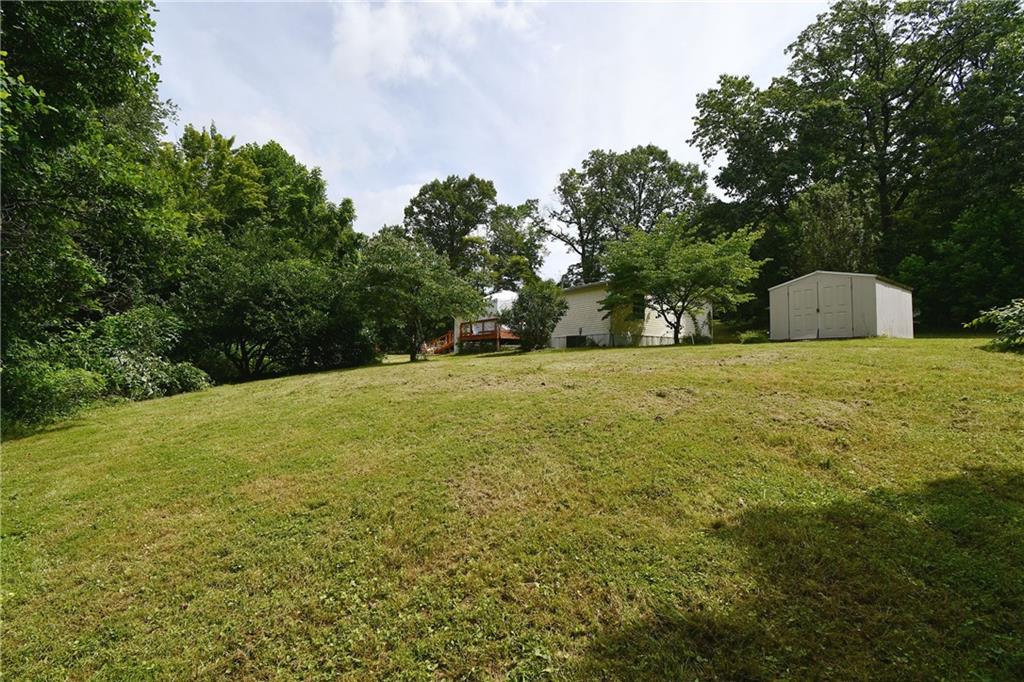 45 Perkins Lane Burgettstown, PA 15021 - Photo 6 of 27 a view of a field with trees in the background