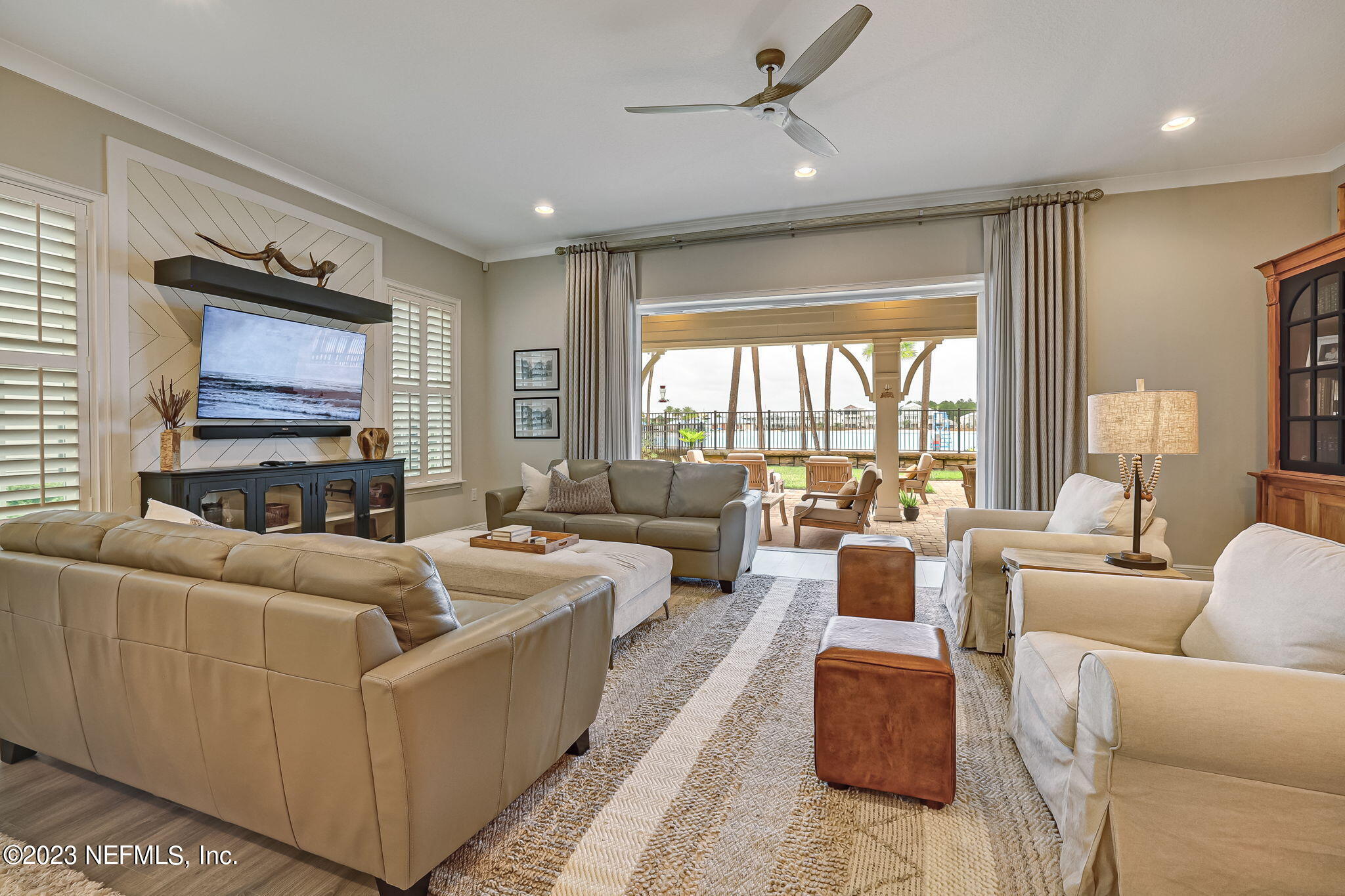 173 Rum Runner Way St. Johns, FL 32259 - Photo 11 of 104 a living room with furniture and a flat screen tv