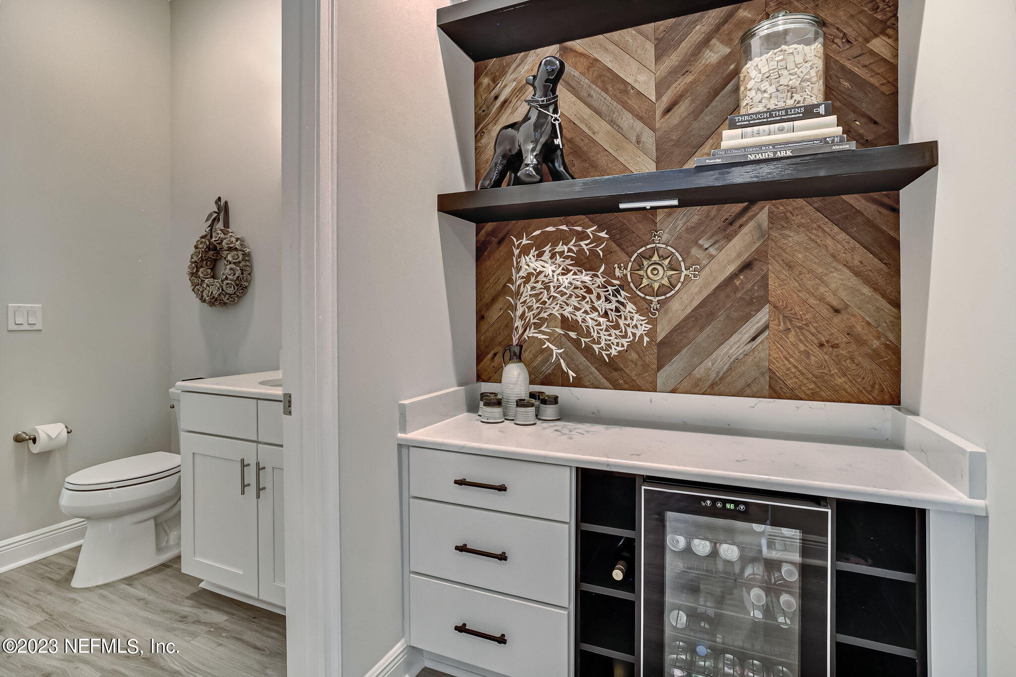 173 Rum Runner Way St. Johns, FL 32259 - Photo 28 of 104 a bathroom with a toilet a sink and mirror