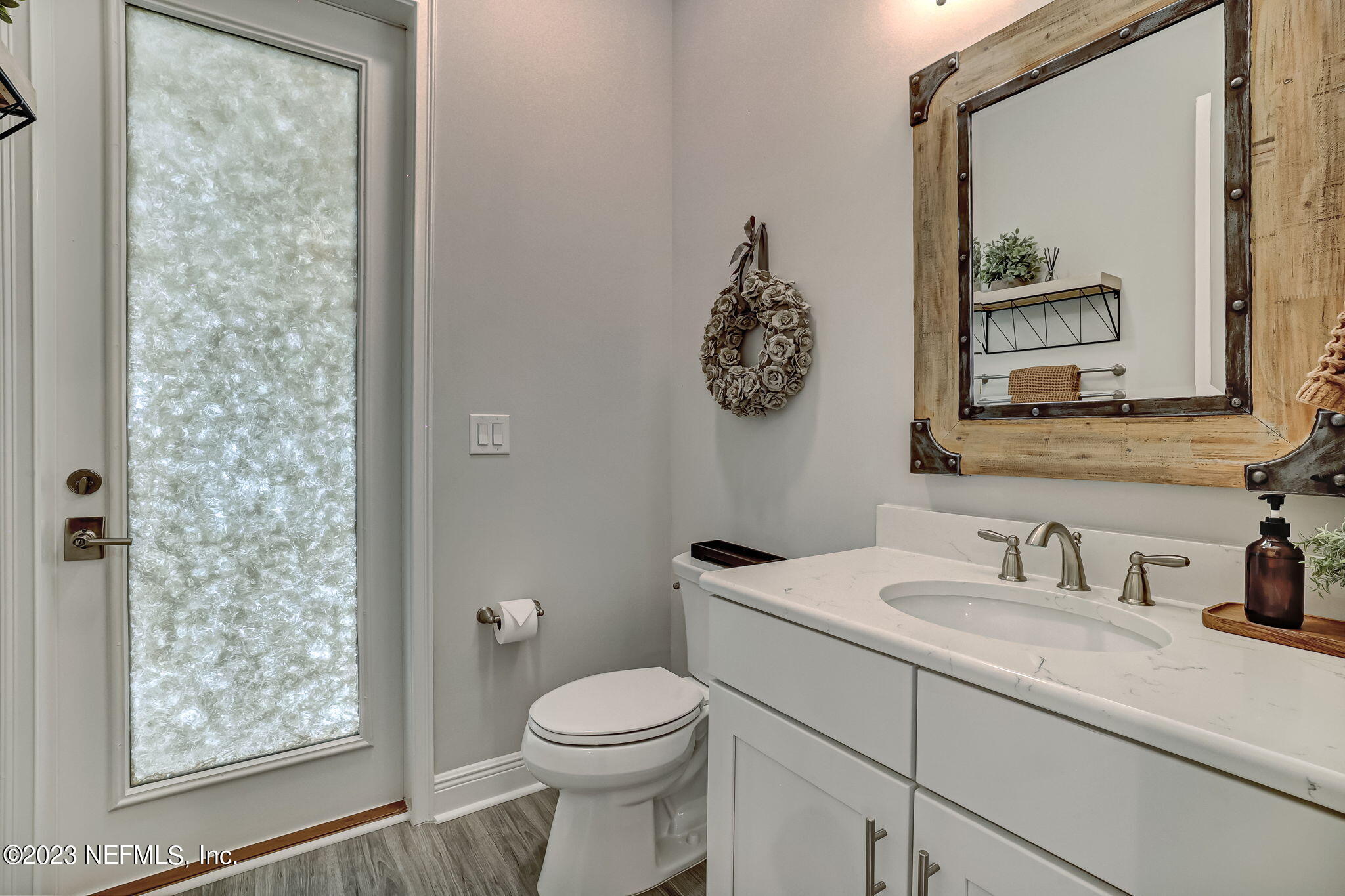 173 Rum Runner Way St. Johns, FL 32259 - Photo 31 of 104 a bathroom with a toilet sink and mirror