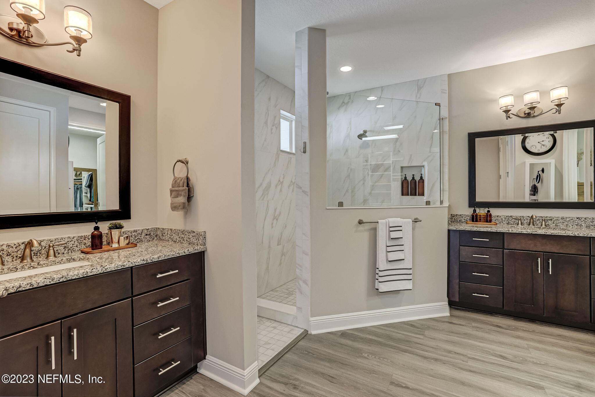 173 Rum Runner Way St. Johns, FL 32259 - Photo 41 of 104 a spacious bathroom with a granite countertop sink and a mirror
