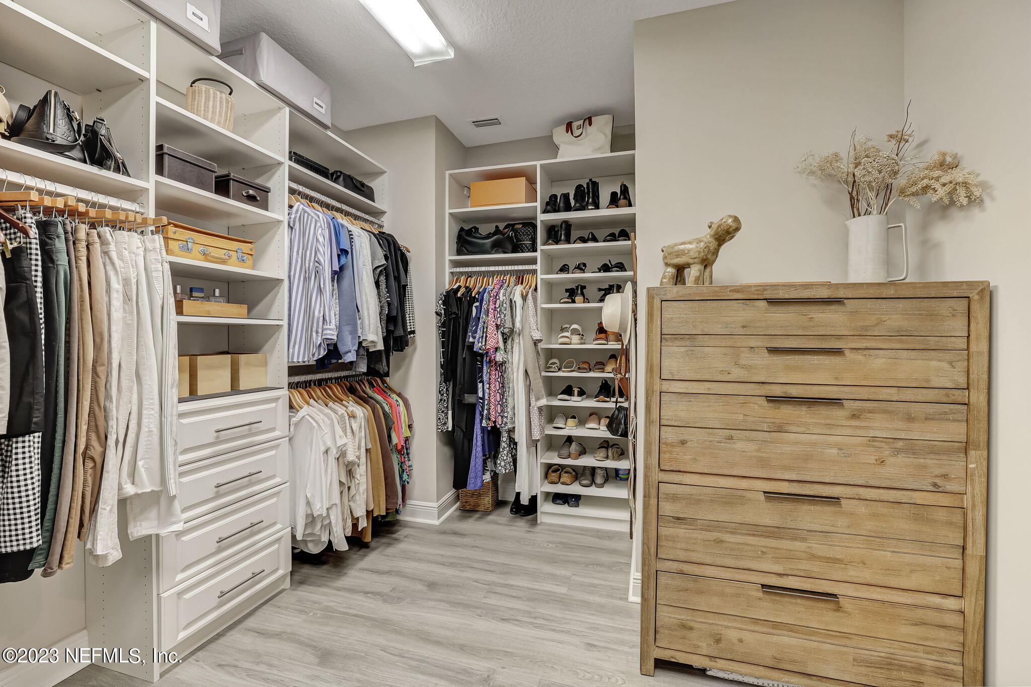 173 Rum Runner Way St. Johns, FL 32259 - Photo 44 of 104 a view of walk in closet with clothes and shoes