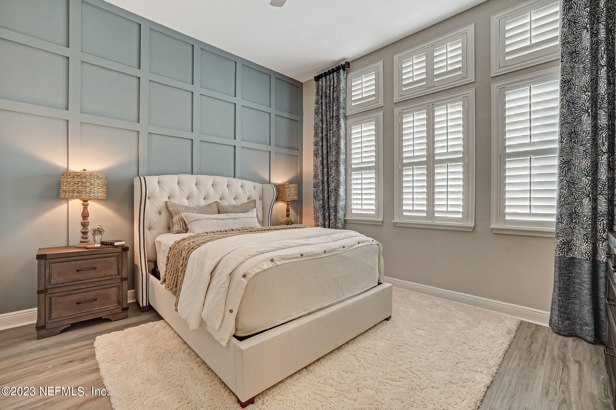 173 Rum Runner Way St. Johns, FL 32259 - Photo 50 of 104 a bedroom with a bed and a night stand