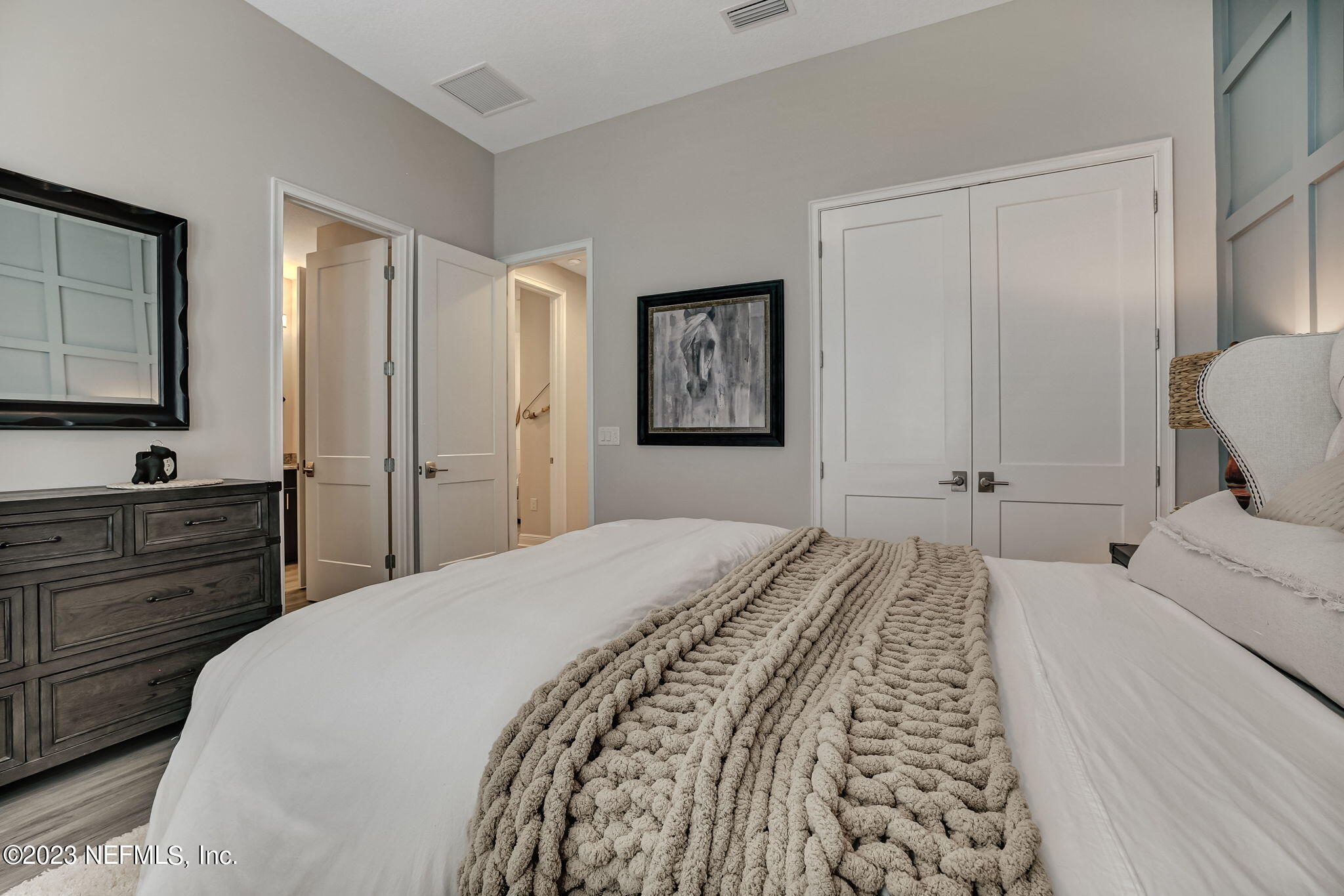 173 Rum Runner Way St. Johns, FL 32259 - Photo 51 of 104 a bedroom with a bed and a flat screen tv