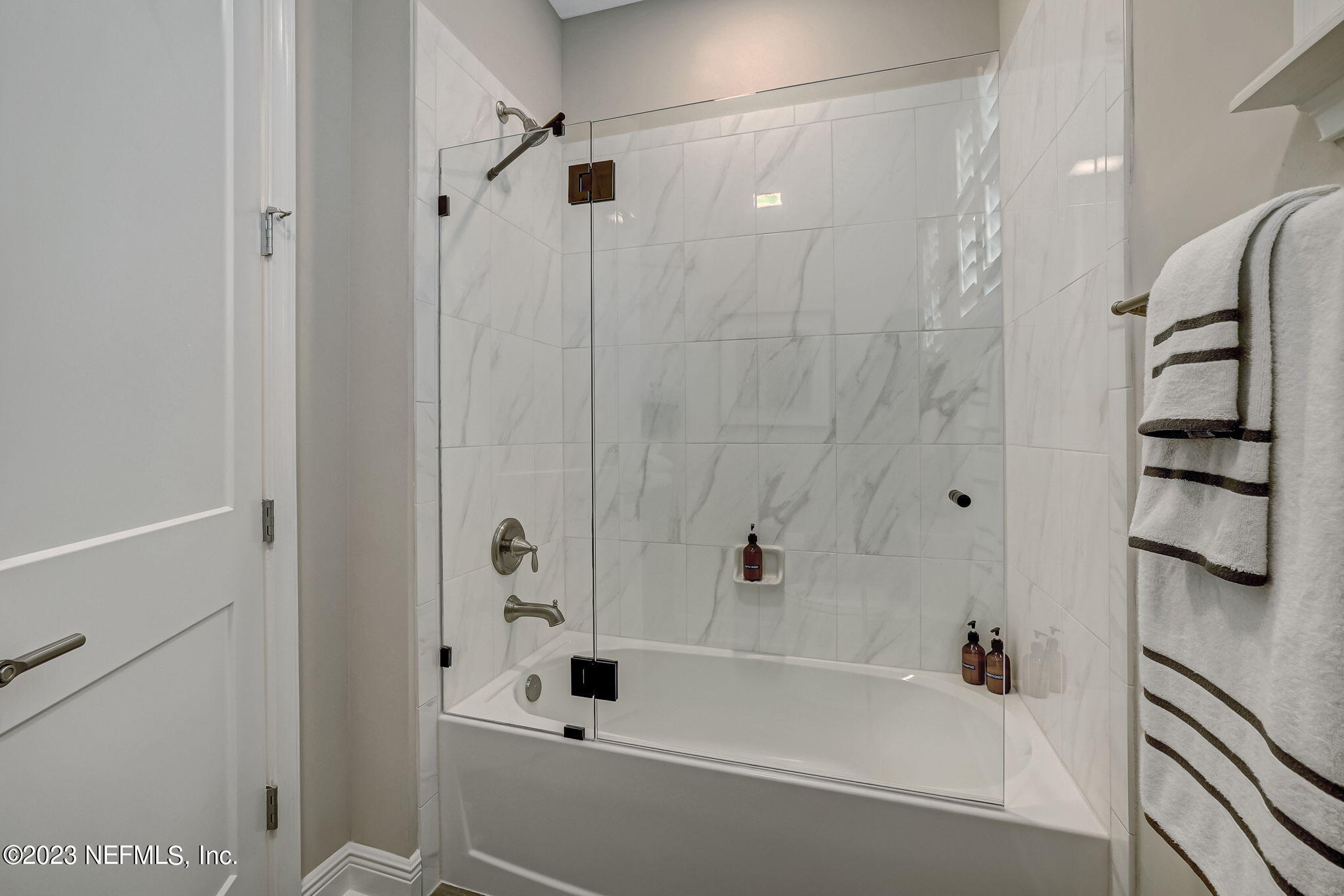 173 Rum Runner Way St. Johns, FL 32259 - Photo 53 of 104 a bathroom with a bathtub and a shower