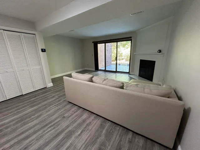 a living room with a couch and a window
