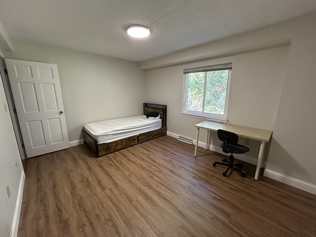 28 Apple Tree Hill Road, Unit 28 Hopkinton, MA 01748 - Photo 10 of 20 a living room with furniture and a wooden floor
