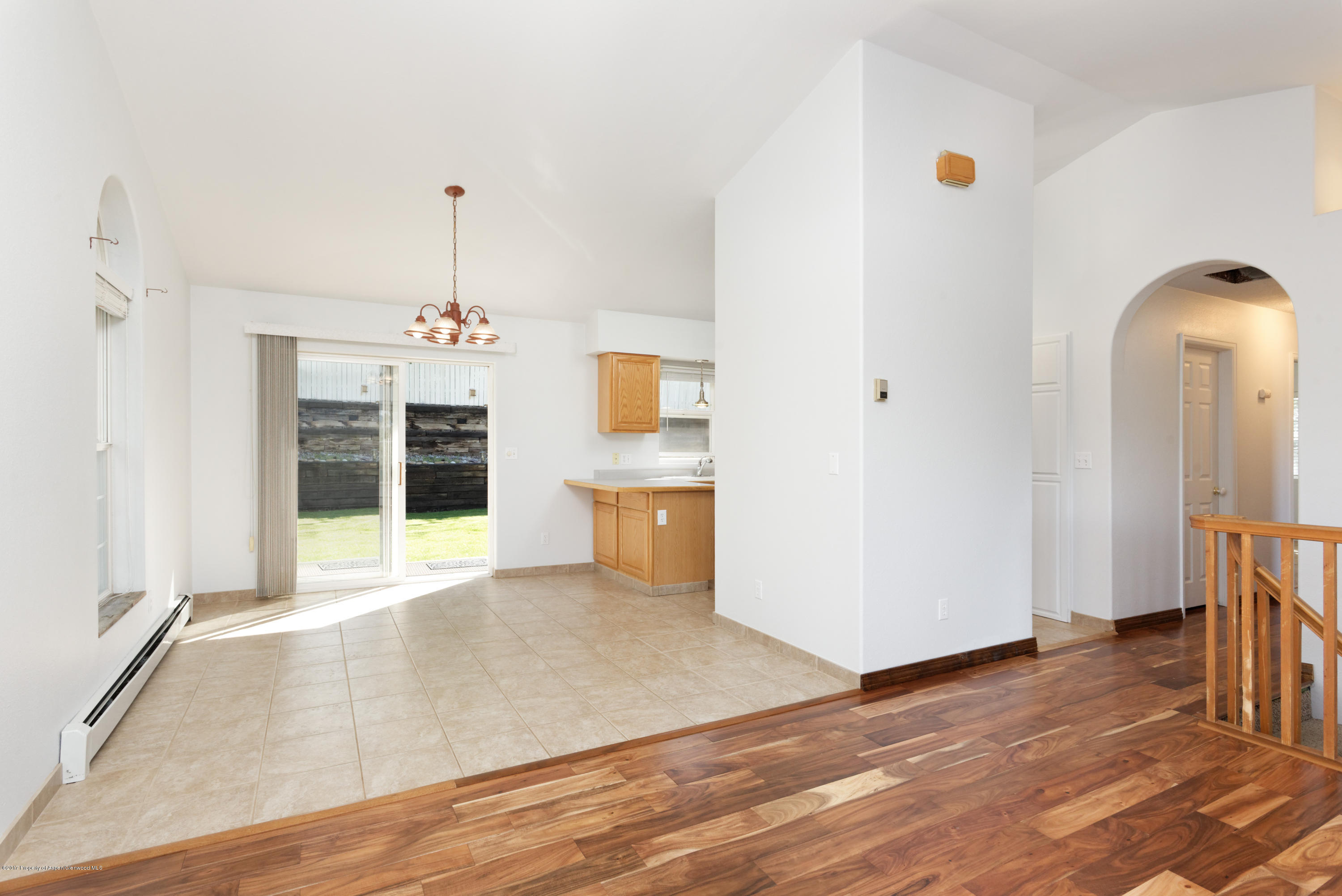 776 Munro Avenue Rifle, CO 81650 - Photo 12 of 24 a view of a room with wooden floor and entryway