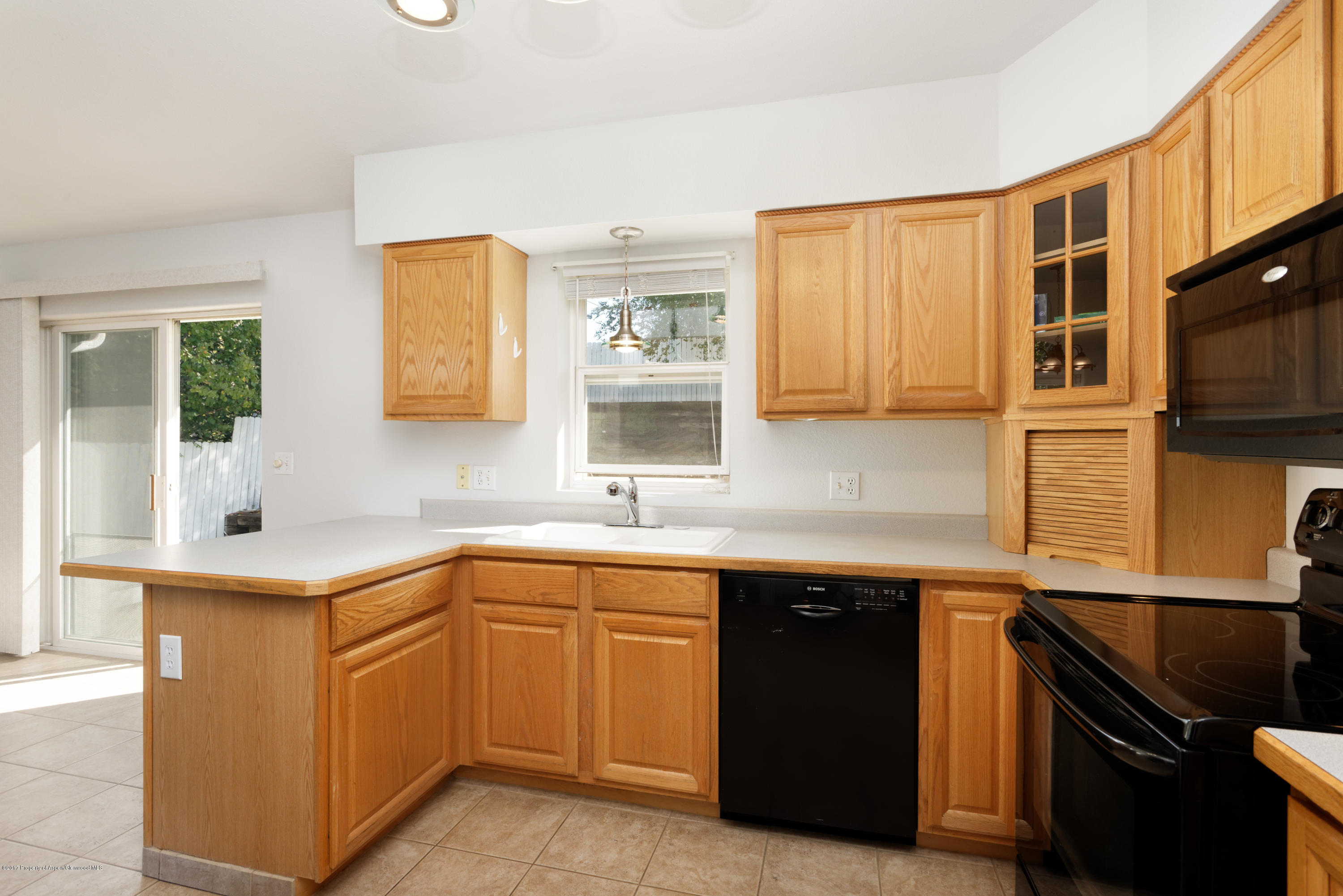 776 Munro Avenue Rifle, CO 81650 - Photo 14 of 24 a kitchen with a sink and cabinets