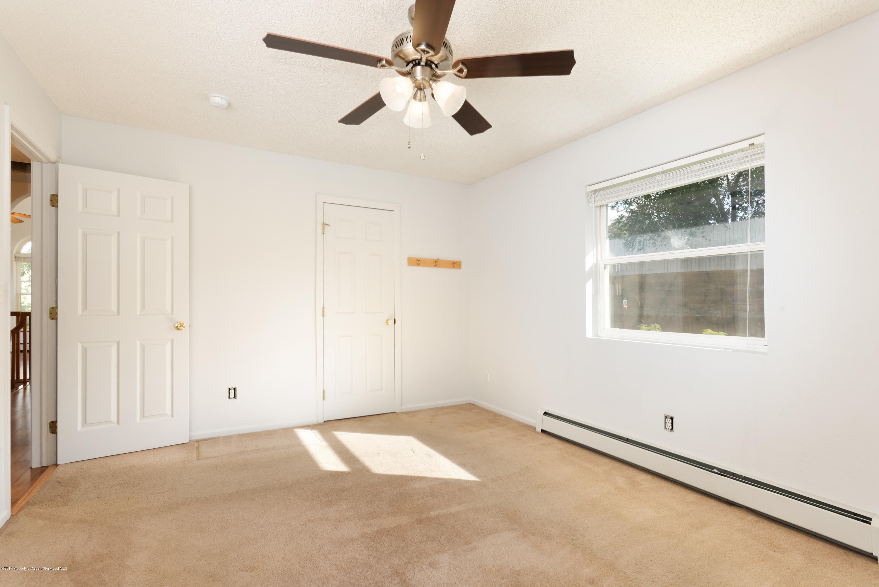 776 Munro Avenue Rifle, CO 81650 - Photo 15 of 24 a view of an empty room with a window
