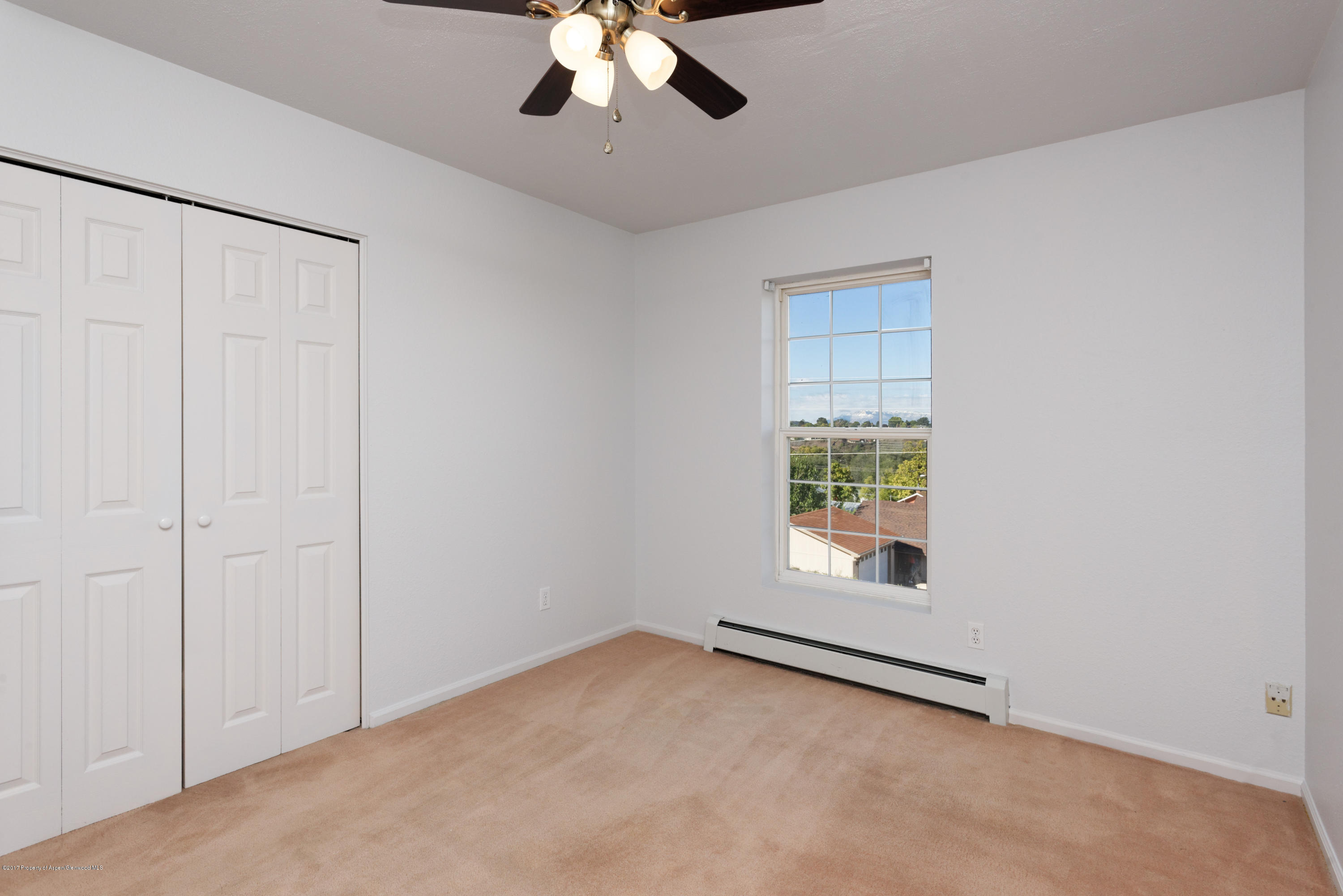 776 Munro Avenue Rifle, CO 81650 - Photo 17 of 24 an empty room with a empty space and windows