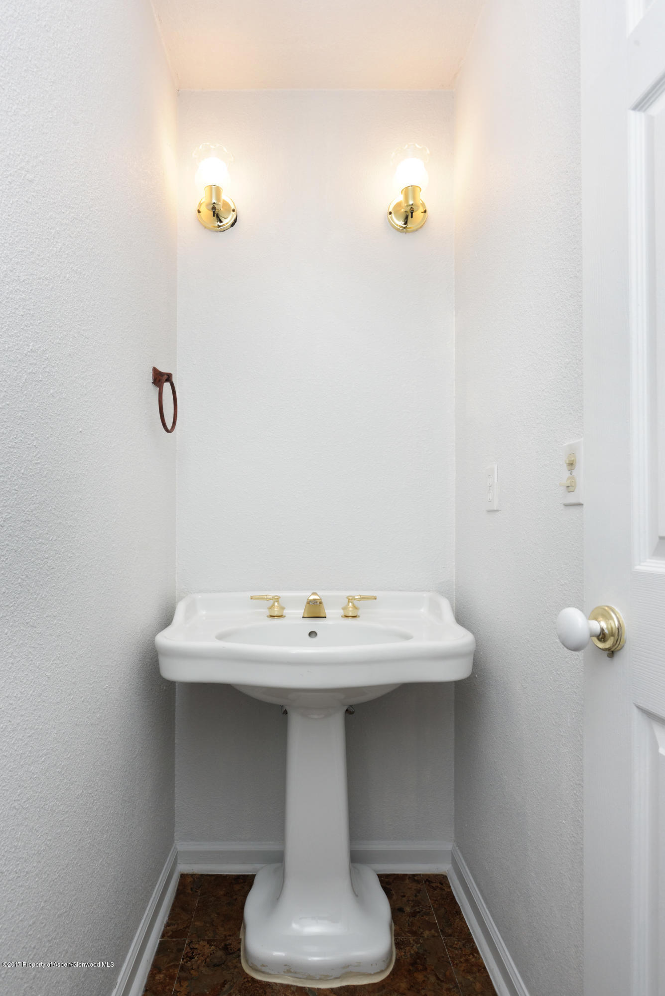 776 Munro Avenue Rifle, CO 81650 - Photo 18 of 24 a bathroom with a sink and a mirror