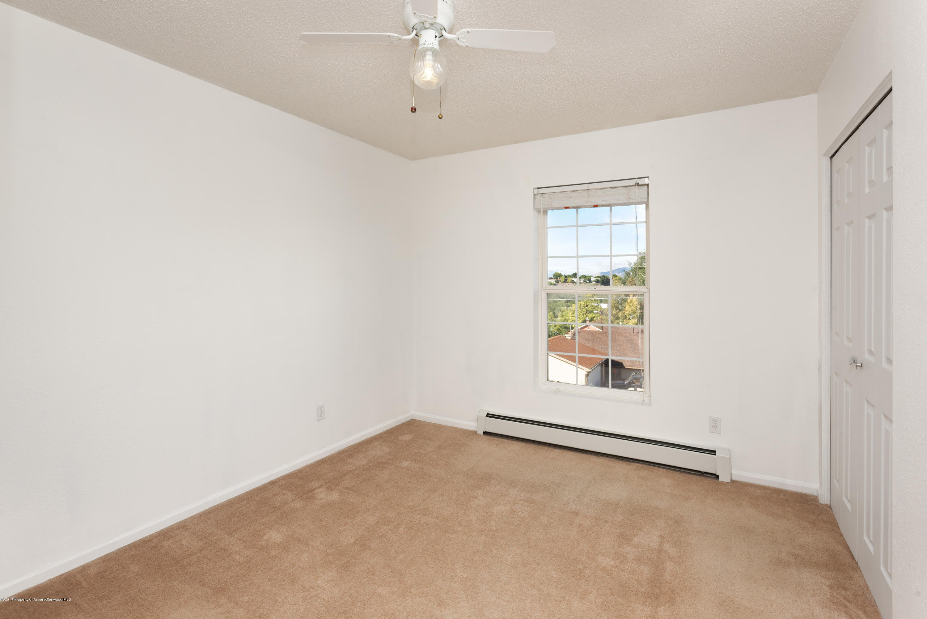 776 Munro Avenue Rifle, CO 81650 - Photo 19 of 24 an empty room with a empty space and a window