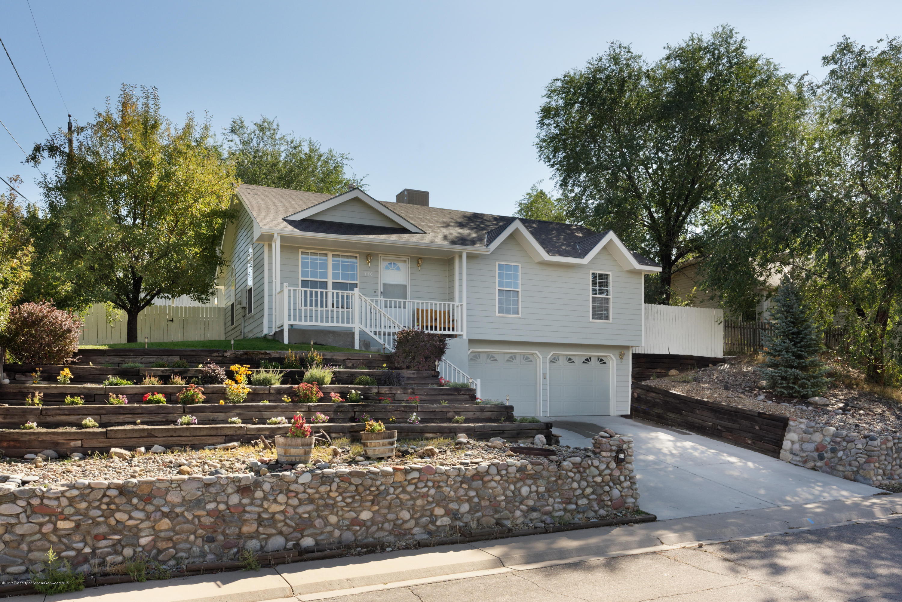 776 Munro Avenue Rifle, CO 81650 - Photo 2 of 24 a front view of a house with a yard
