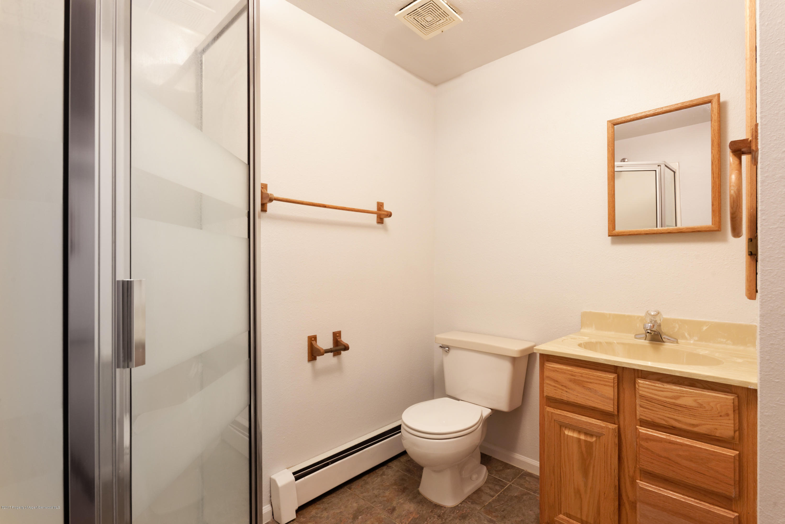 776 Munro Avenue Rifle, CO 81650 - Photo 21 of 24 a bathroom with a toilet a sink and shower