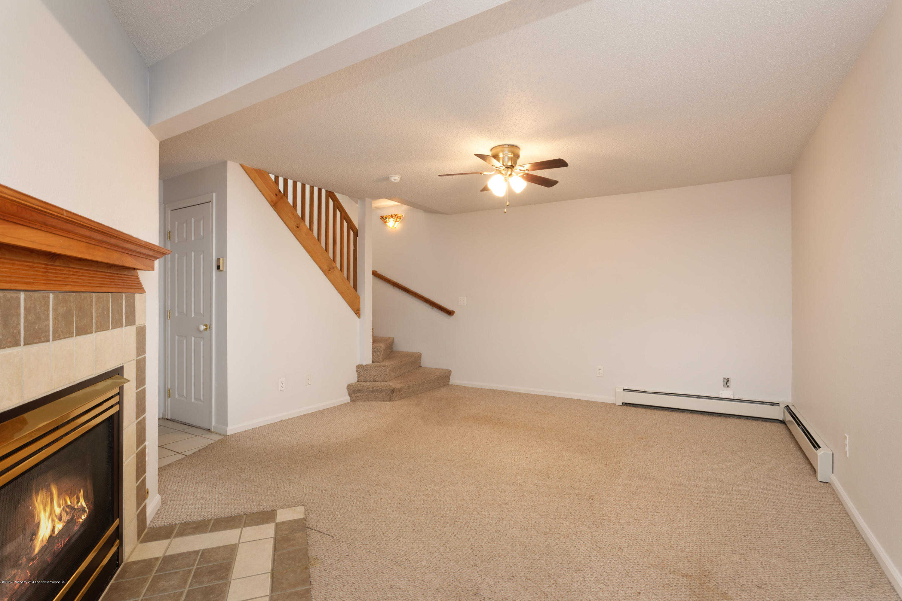 776 Munro Avenue Rifle, CO 81650 - Photo 22 of 24 a view of an empty room with a fireplace