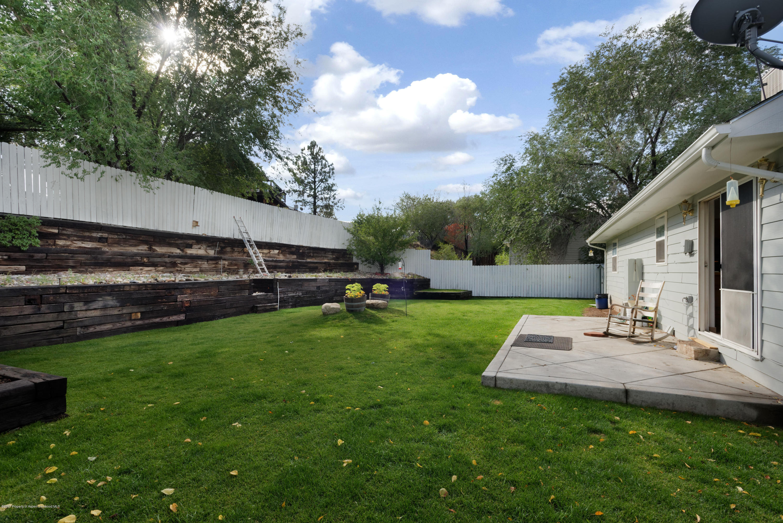 776 Munro Avenue Rifle, CO 81650 - Photo 5 of 24 a view of a house with backyard and sitting area