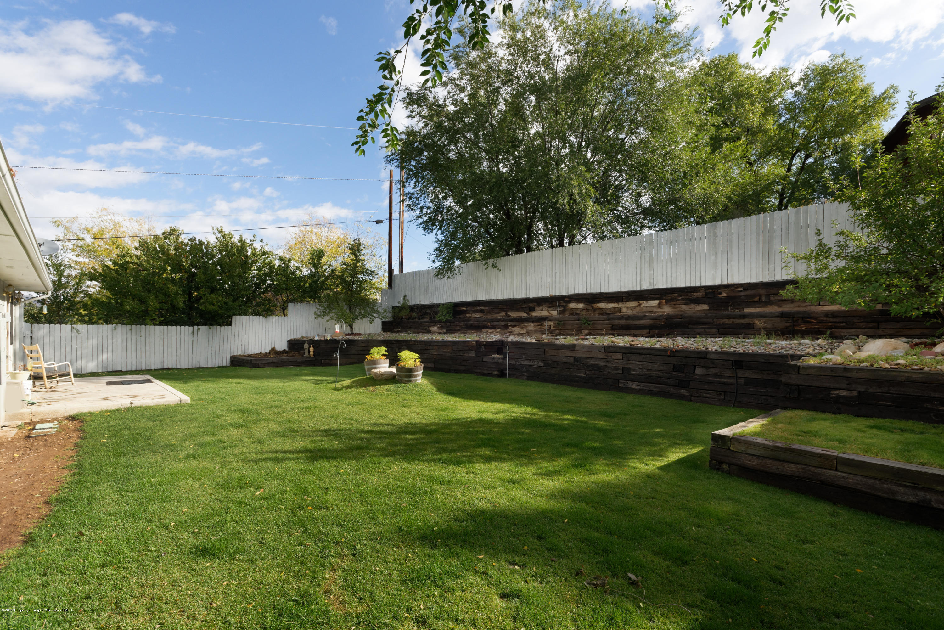 776 Munro Avenue Rifle, CO 81650 - Photo 6 of 24 a view of a garden with sitting area