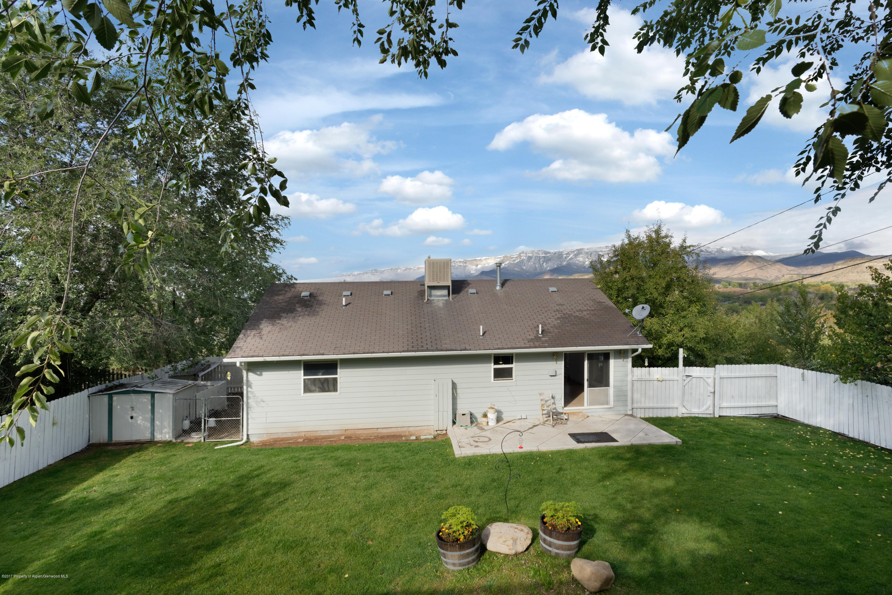 776 Munro Avenue Rifle, CO 81650 - Photo 7 of 24 a front view of house with yard and trees