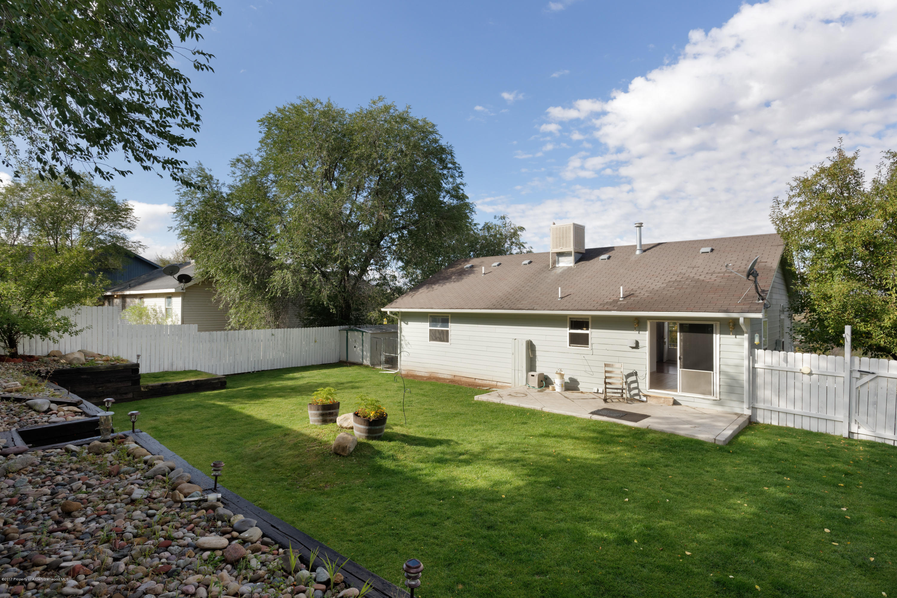 776 Munro Avenue Rifle, CO 81650 - Photo 8 of 24 a front view of house with yard and green space