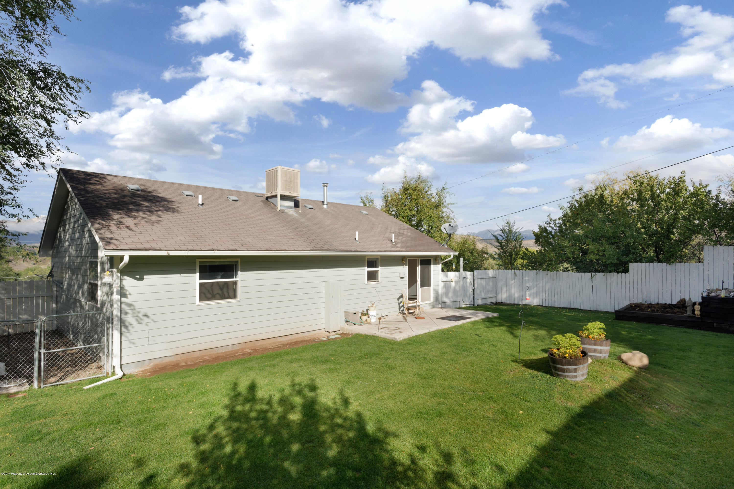 776 Munro Avenue Rifle, CO 81650 - Photo 9 of 24 a front view of a house with garden
