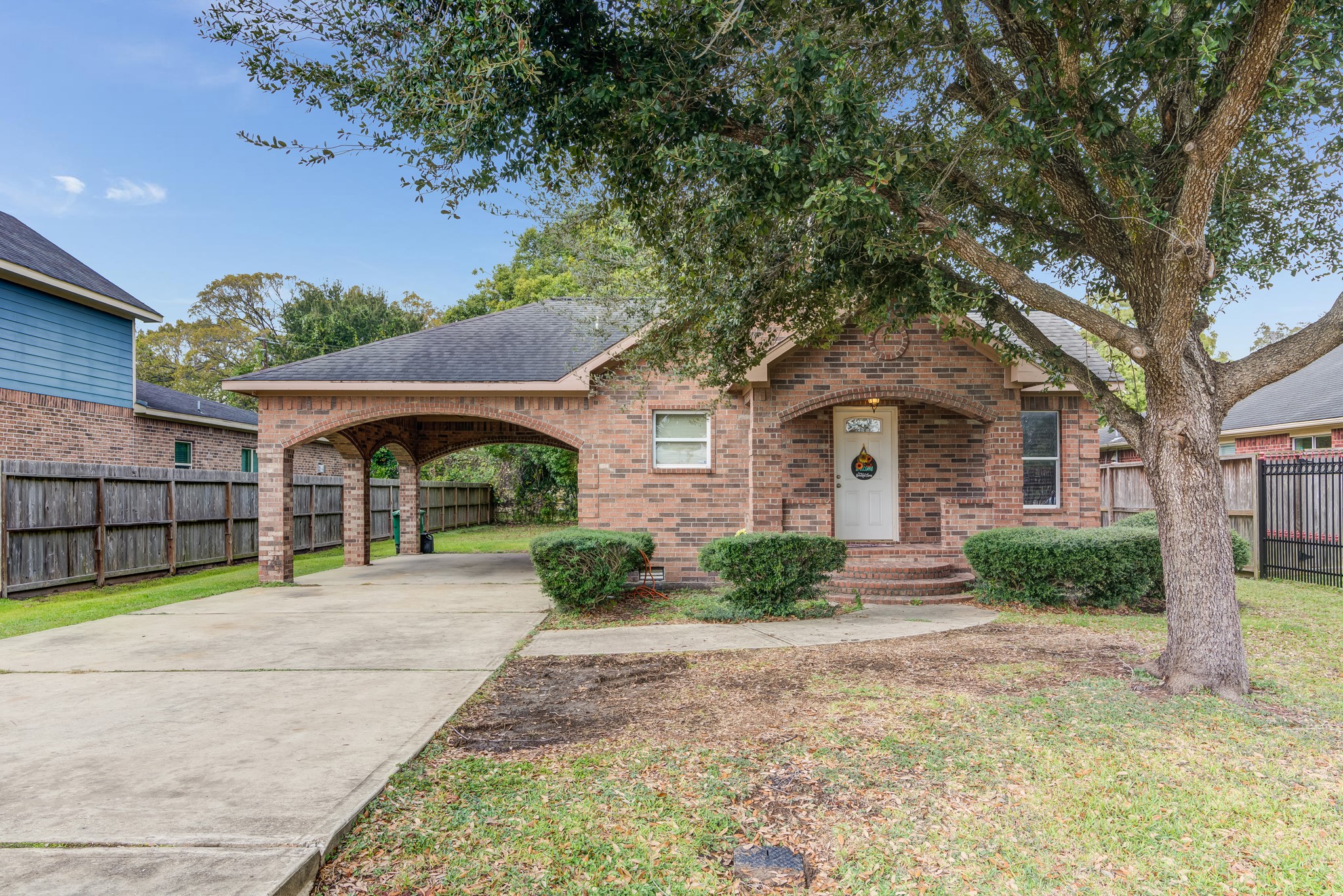 8123 Tareyton Lane Houston, TX 77075 - Photo 1 of 27 a front view of a house with a yard and potted plants