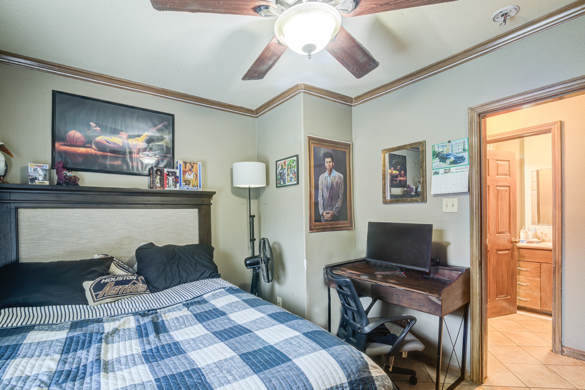 8123 Tareyton Lane Houston, TX 77075 - Photo 13 of 27 a bedroom with furniture and a flat screen tv
