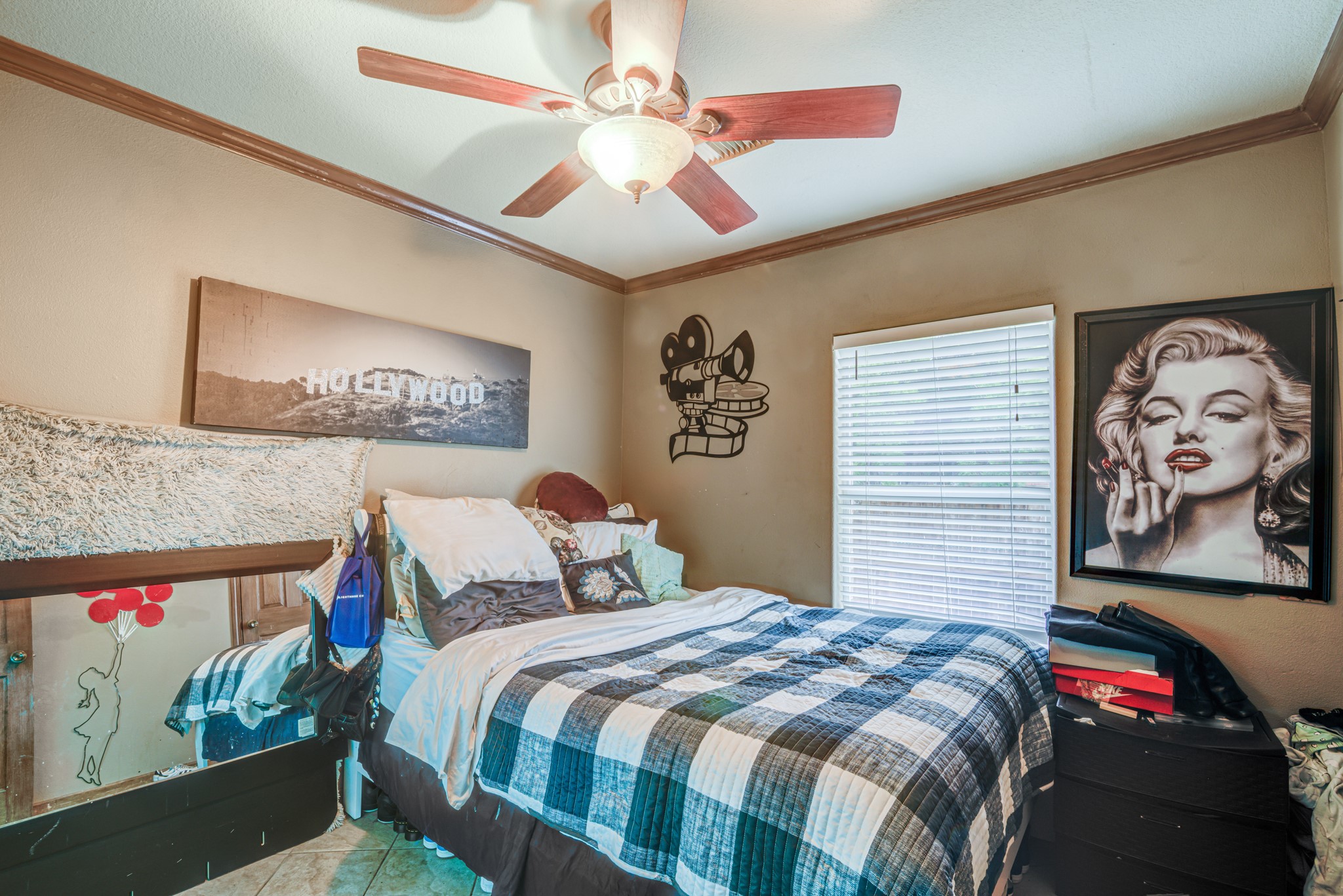 8123 Tareyton Lane Houston, TX 77075 - Photo 14 of 27 a bedroom with a bed and a painting on the wall