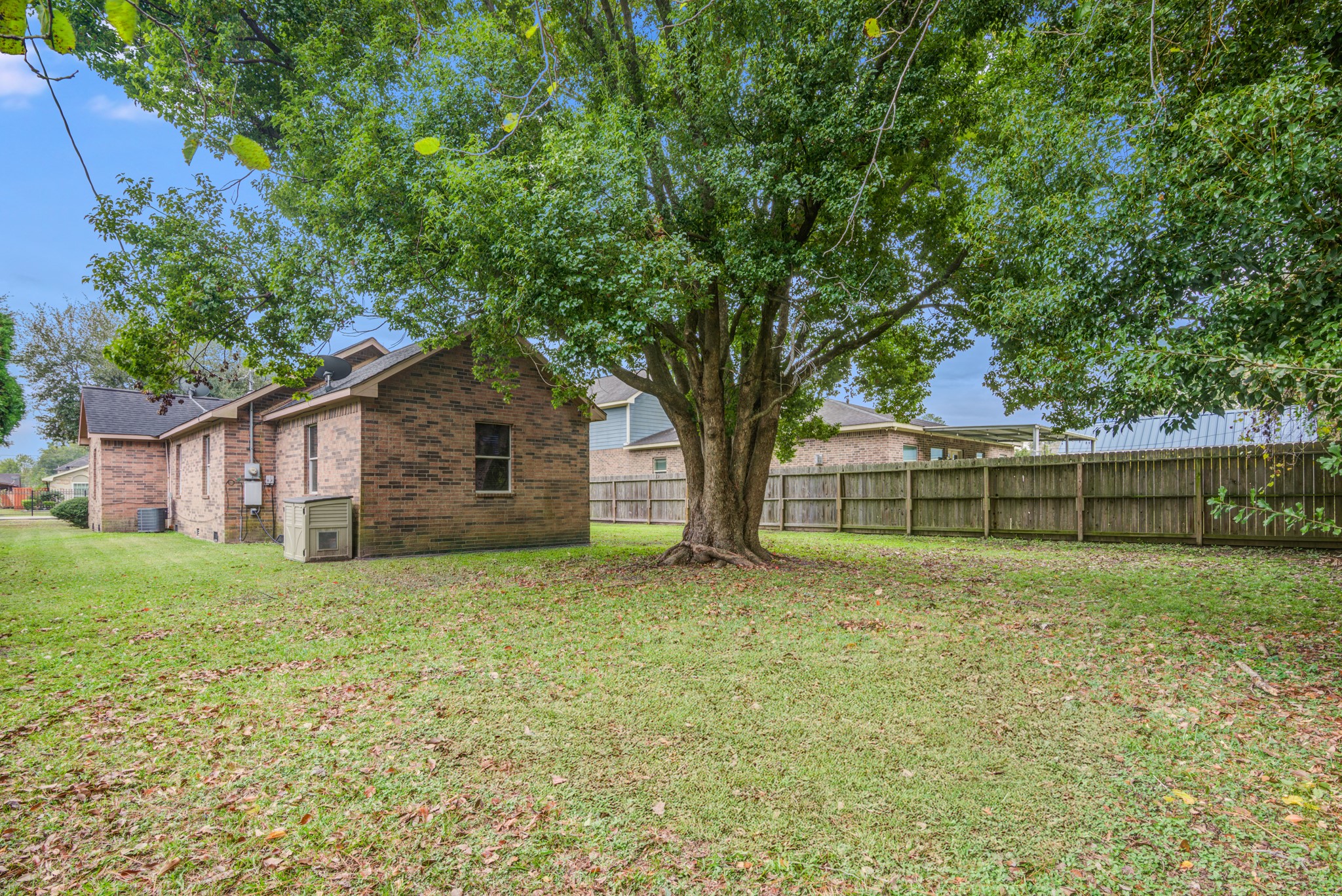 8123 Tareyton Lane Houston, TX 77075 - Photo 25 of 27 a house with a tree in front of a house