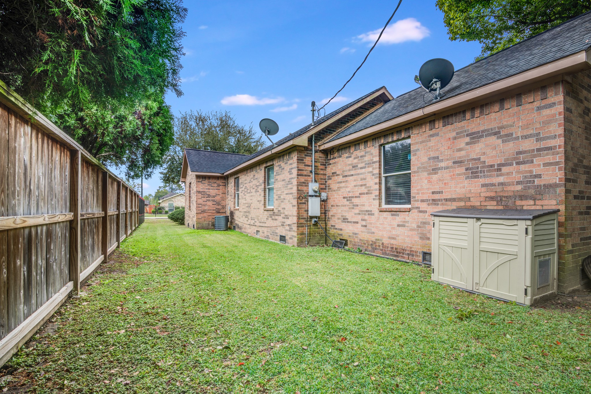 8123 Tareyton Lane Houston, TX 77075 - Photo 27 of 27 a backyard of a house with lots of green space