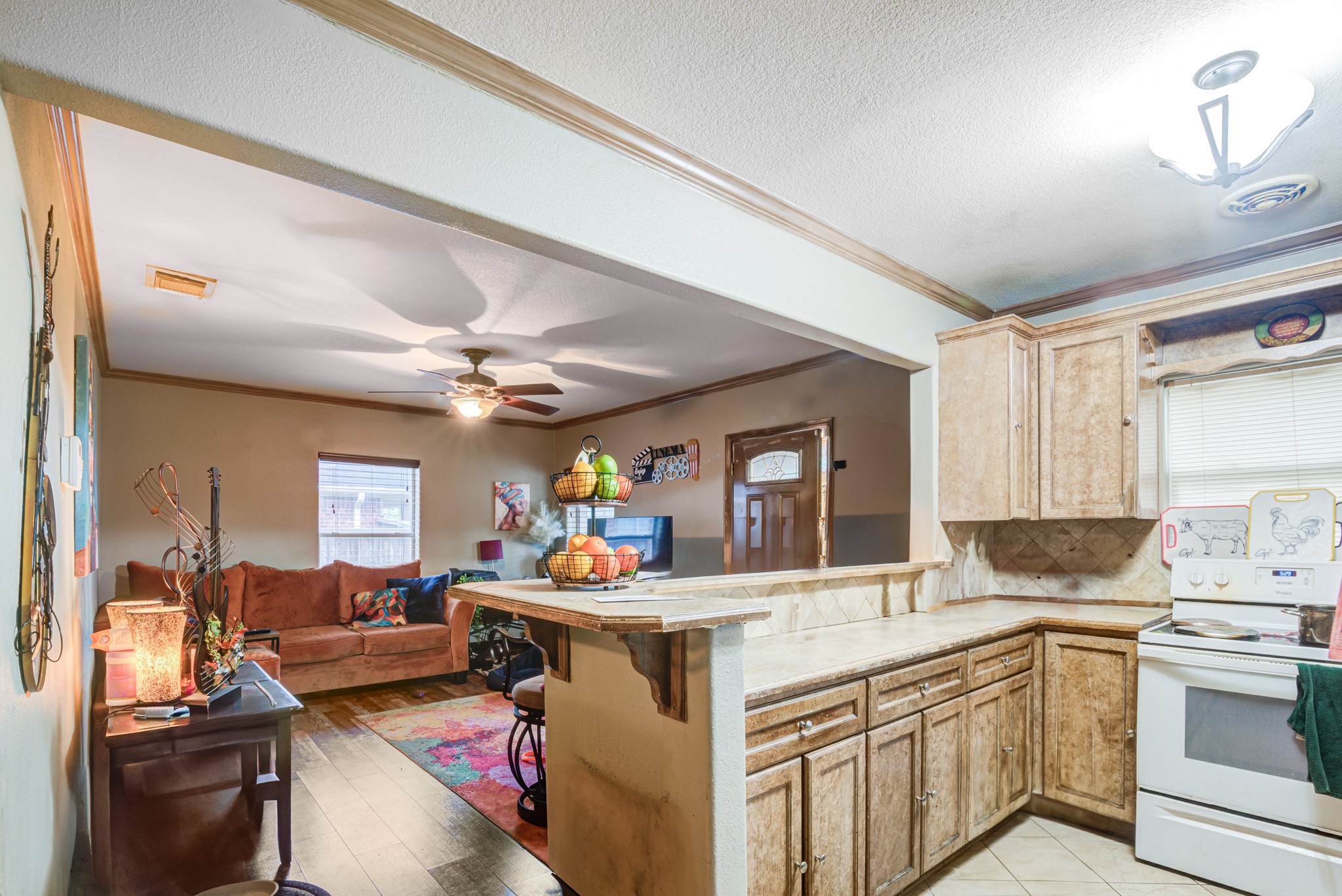 8123 Tareyton Lane Houston, TX 77075 - Photo 8 of 27 a kitchen that has a lot of cabinets a sink and a stove in it