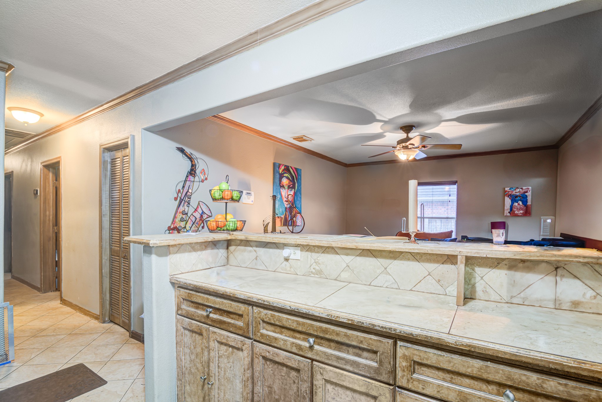 8123 Tareyton Lane Houston, TX 77075 - Photo 9 of 27 a view of a kitchen with furniture and flat screen tv